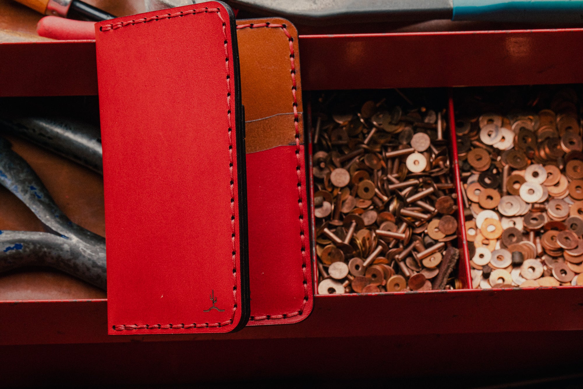 red exterior and brown interior leather wallet with four card pockets