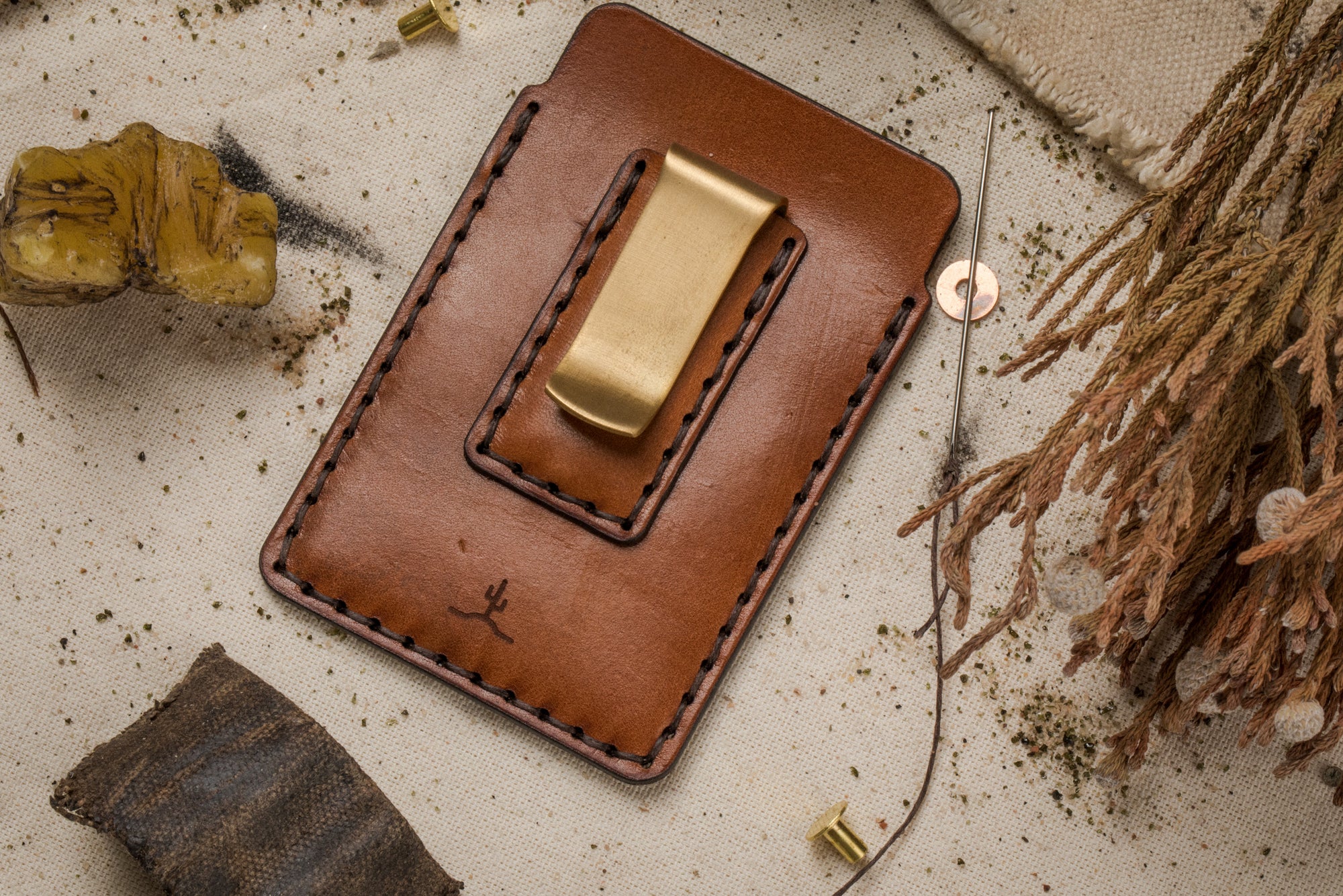 two pocket simple brown leather wallet with brass money clip on exterior back