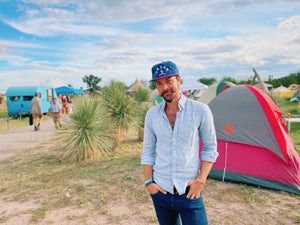 Model wearing the Blue Bexar Cap outdoors, demonstrating the perfect fit and style