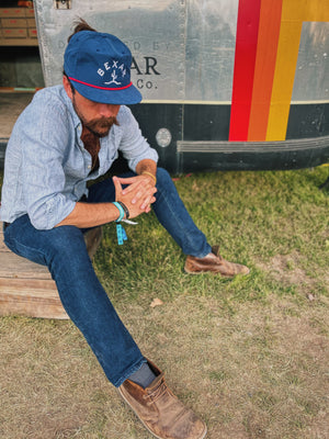 Model wearing the Blue Bexar Cap outdoors, demonstrating the perfect fit and style